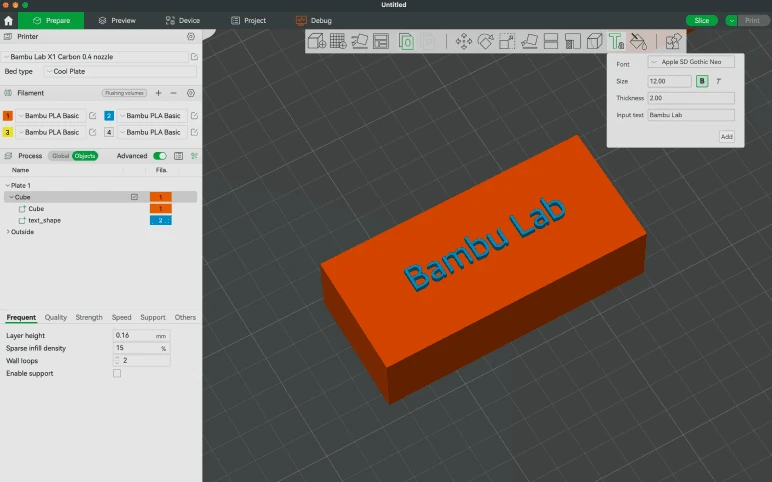 Bambu Studio text tool placing blue Bambu Lab lettering on an orange rectangular model