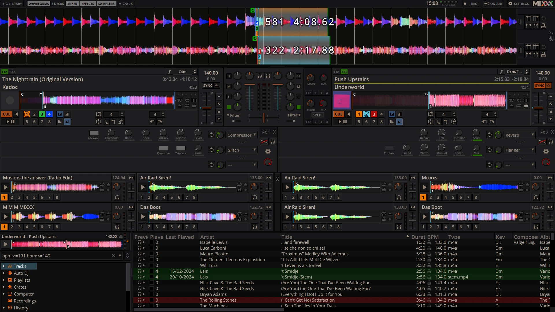 Mixxx DJ interface with two decks, sampler slots and music library