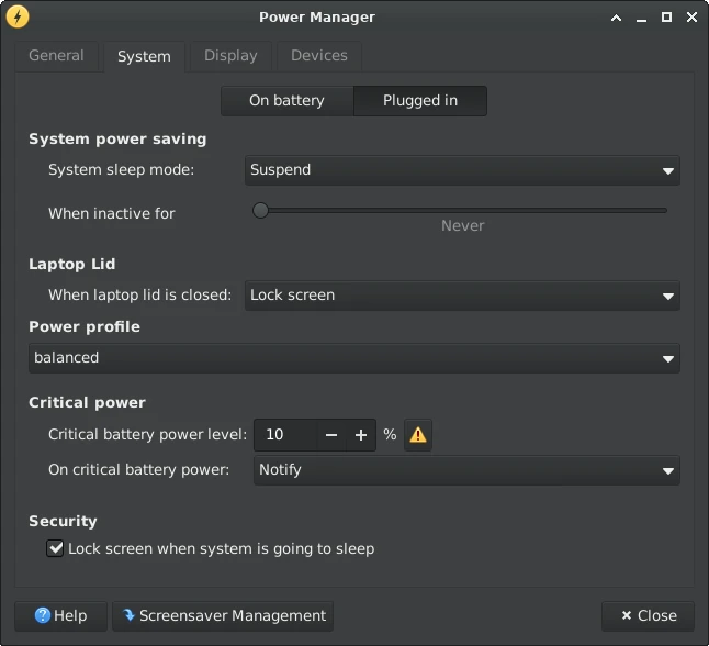 Xfce Power Manager settings dialog on the System tab in a dark theme
